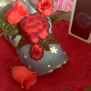 Nice jean hat with a rose on it and a IPhone box!!